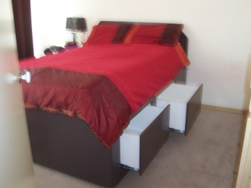 Hidden push release draws under mattress