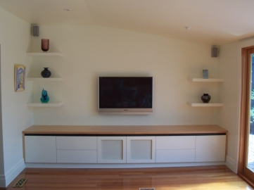 Painted 2pac TV unit with floating shelves above. Top and infills in Tas Oak 50% clear lacquered